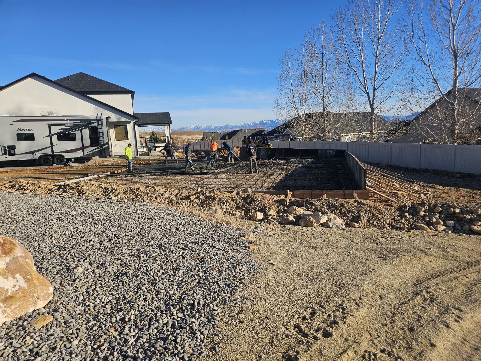 West Jordan Concrete crew finishing a concrete slab in Utah