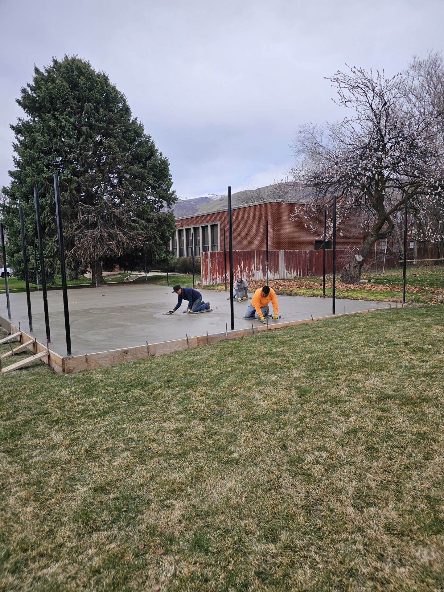West Jordan Concrete crew finishing a patio slab in Utah