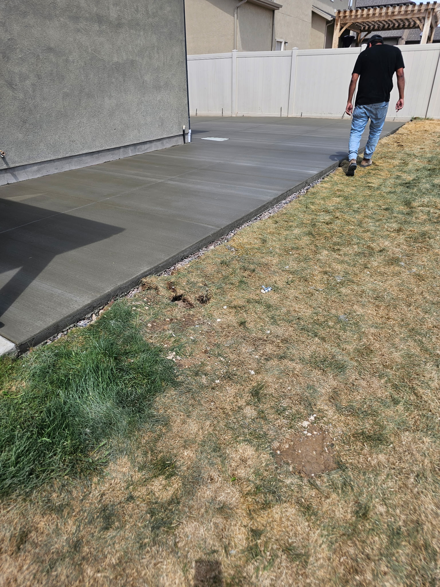 Concrete walkway along a Utah side yard